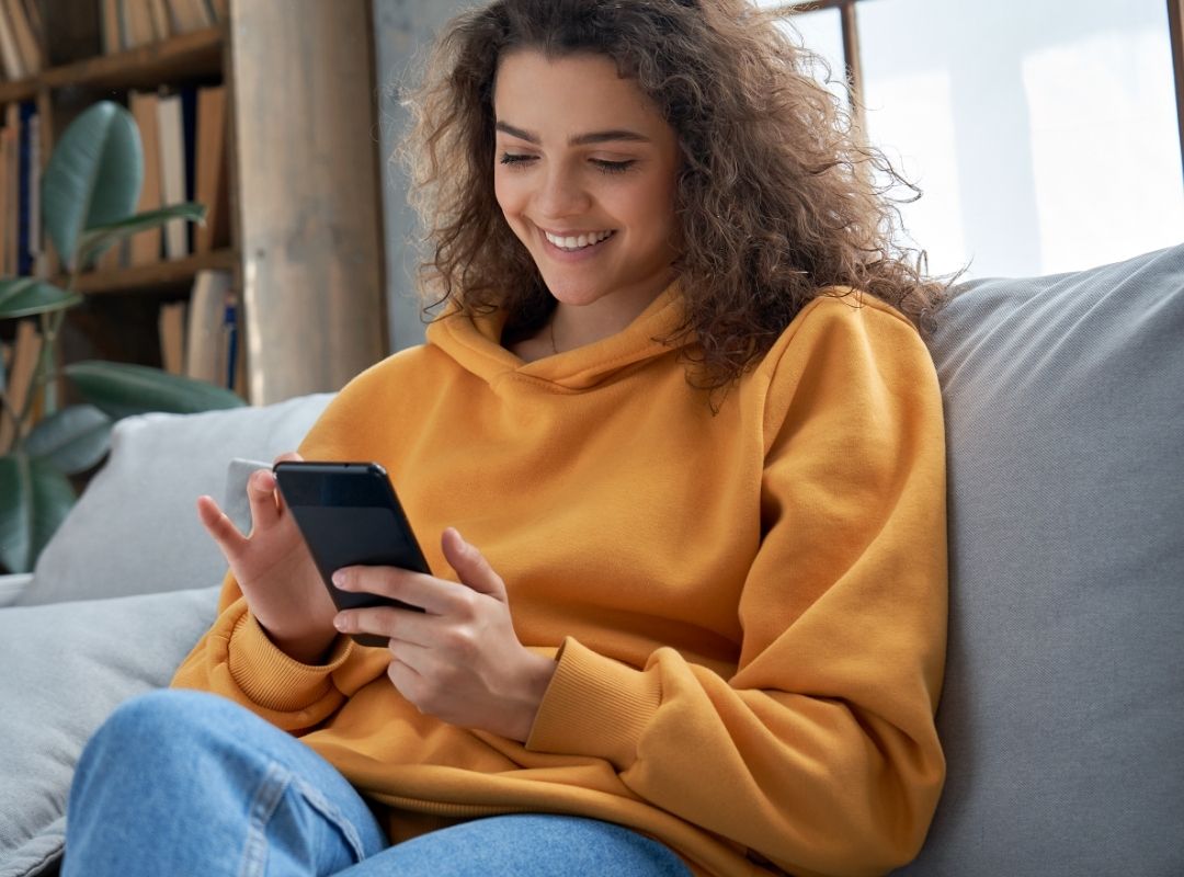 Woman using smartphone 2x